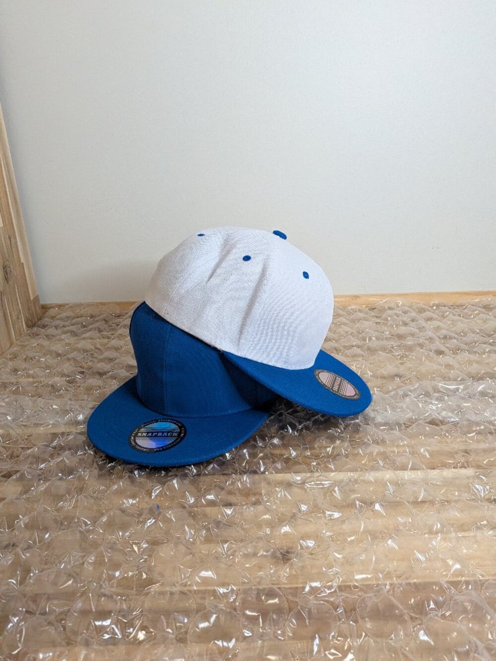 Royal blue and white baseball caps.